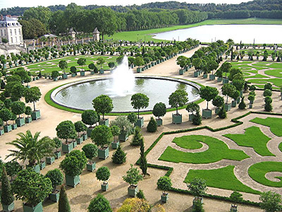 Parterres and orange trees outside the Orangerie on the grounds of Versailles.