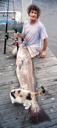 Robert Adamson with mulloway, 1991, photo Juno Gemes.